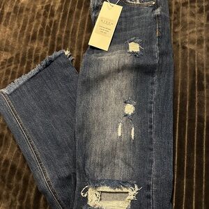 Women's Distressed Risen Blue Jeans